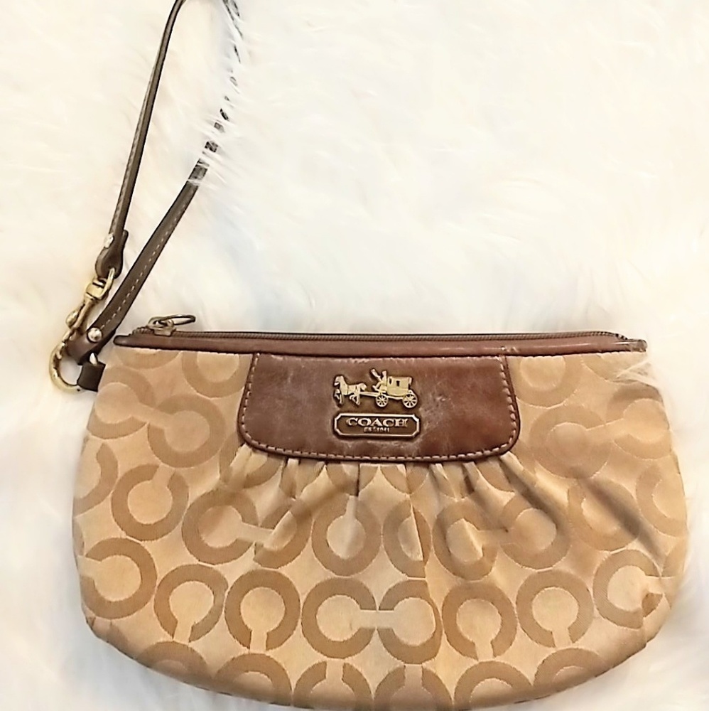 coach | gold wristlet with logo